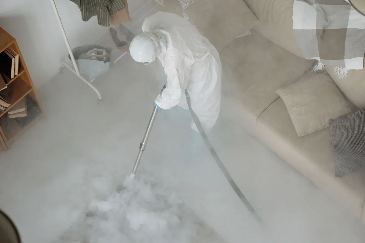 Biohazard cleanup technician in protective equipment, Rosharon, TX